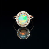 Oval Opal and Diamond Halo Ring in Rose Gold